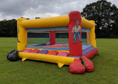 Inflatable boxing ring and giant gloves